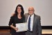 Dr. Nagib Callaos, General Chair, giving Renata Baracho an award certificate in appreciation for his presentation oriented to inter-disciplinary communication entitled: "Decision Making in Real Estate Developments Based on Building Information Modeling – BIM."